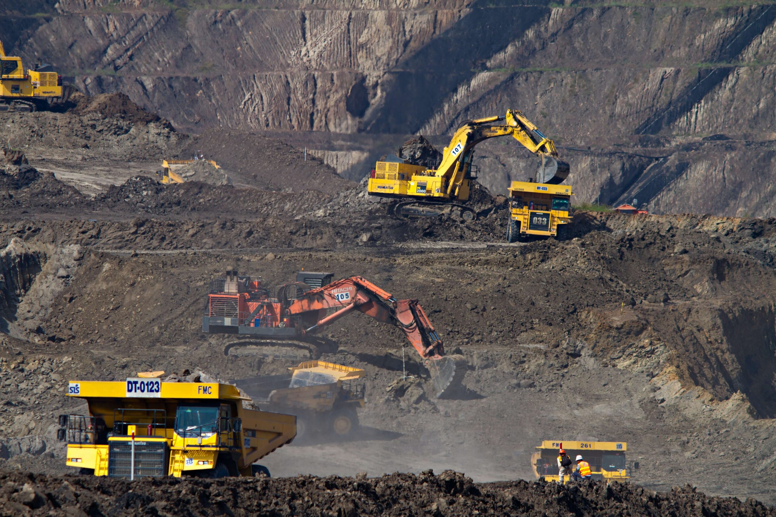 Mine Image with Trucks and Earth Movers